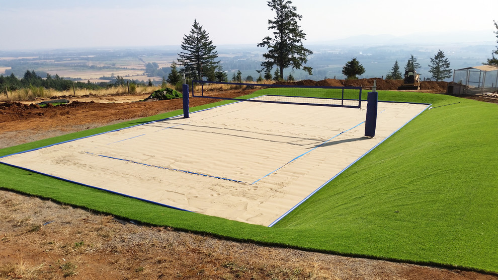Photo of a large beach style backyard full sun outdoor sport court for summer in Seattle with with outdoor playset.