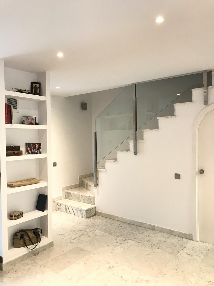 Mid-sized eclectic marble straight staircase in Other with marble risers and mixed railing.