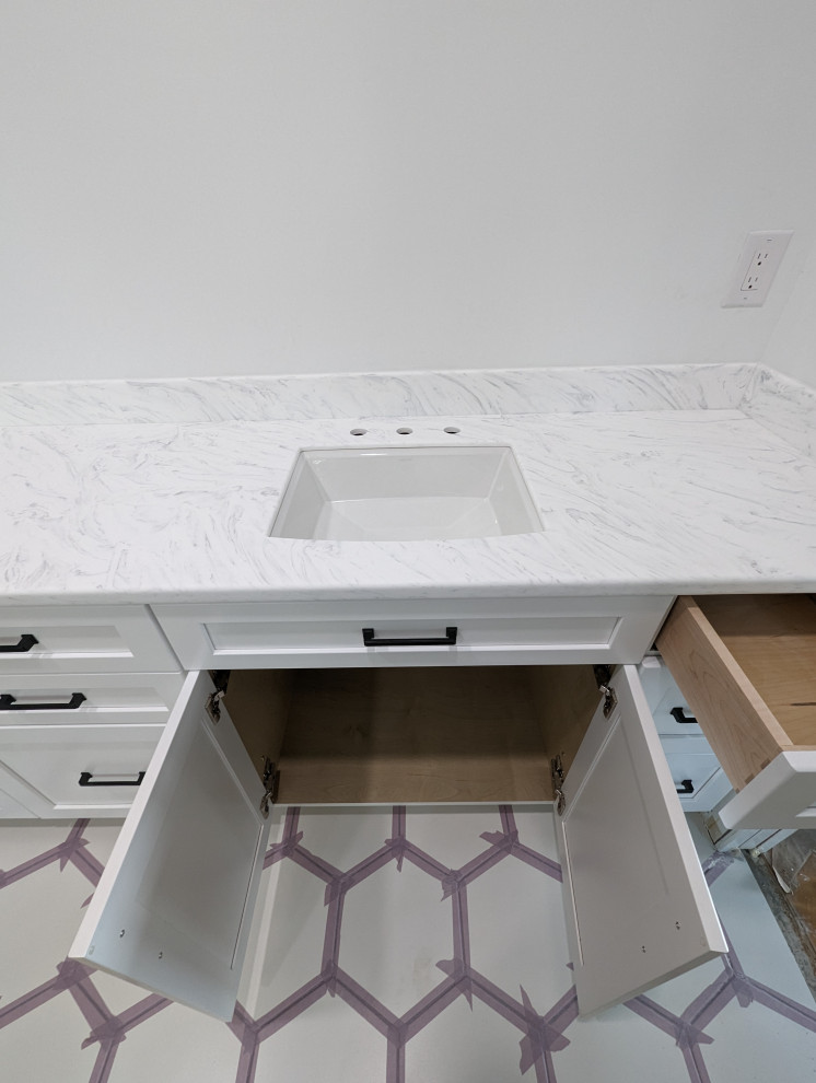 Bathroom - mid-sized master white floor and double-sink bathroom idea with flat-panel cabinets, white cabinets, solid surface countertops, white countertops and a built-in vanity