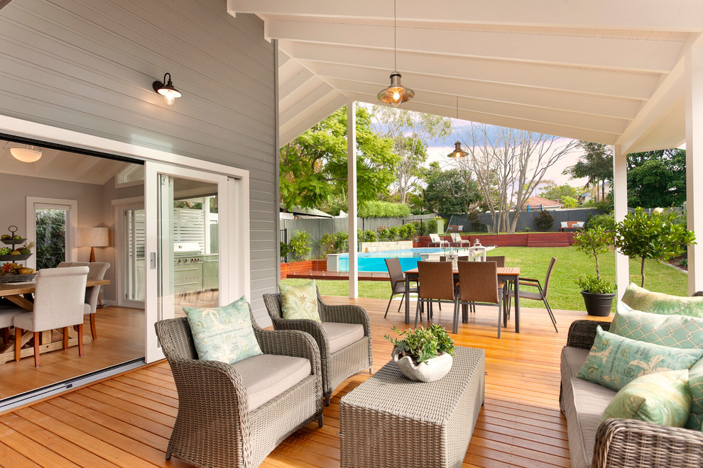 This is an example of a country side yard deck in Central Coast with a roof extension.
