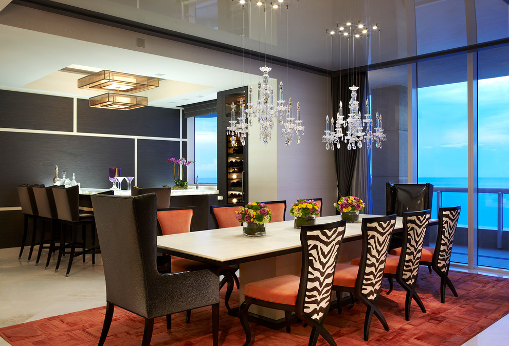 Example of a large trendy beige floor enclosed dining room design in Miami with gray walls and no fireplace