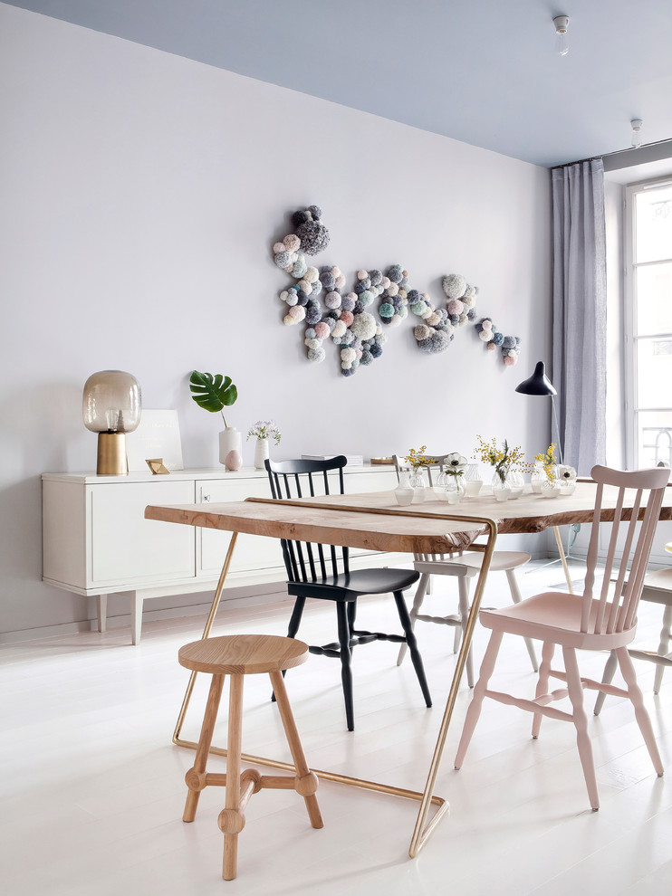 Mid-sized scandinavian dining room in Paris with grey walls, painted wood floors and no fireplace.