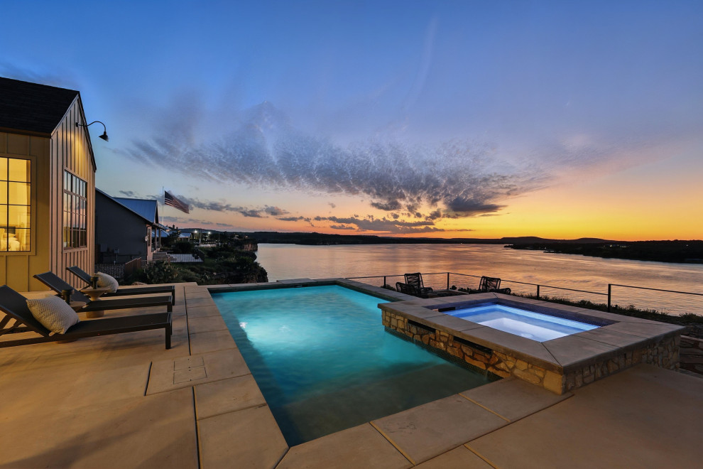Example of a mid-sized minimalist backyard rectangular pool design in Dallas
