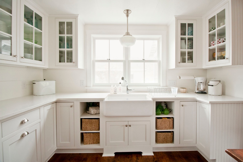 Inspiration for a mid-sized country l-shaped eat-in kitchen in Other with a farmhouse sink, shaker cabinets, white cabinets, quartz benchtops, white splashback, stainless steel appliances, dark hardwood floors, no island and timber splashback.