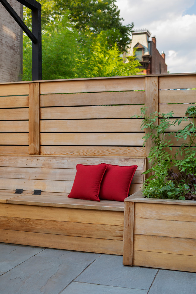 Design ideas for a small contemporary backyard stone landscaping in New York.