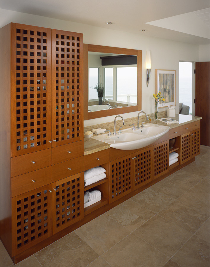 Design ideas for a mid-sized contemporary 3/4 bathroom in Orange County with flat-panel cabinets and light wood cabinets.