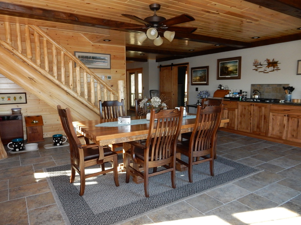 Kitchen/dining room combo - mid-sized rustic ceramic tile and beige floor kitchen/dining room combo idea with white walls