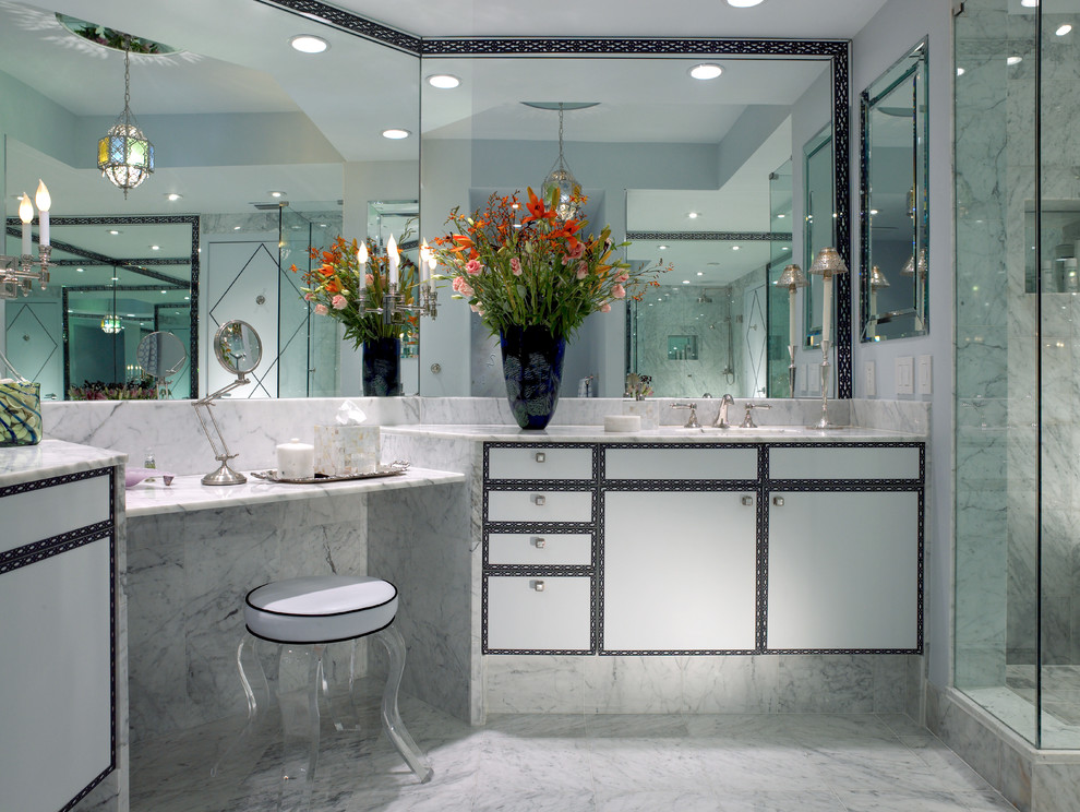 Inspiration for a contemporary bathroom in Miami with a corner shower and marble floors.