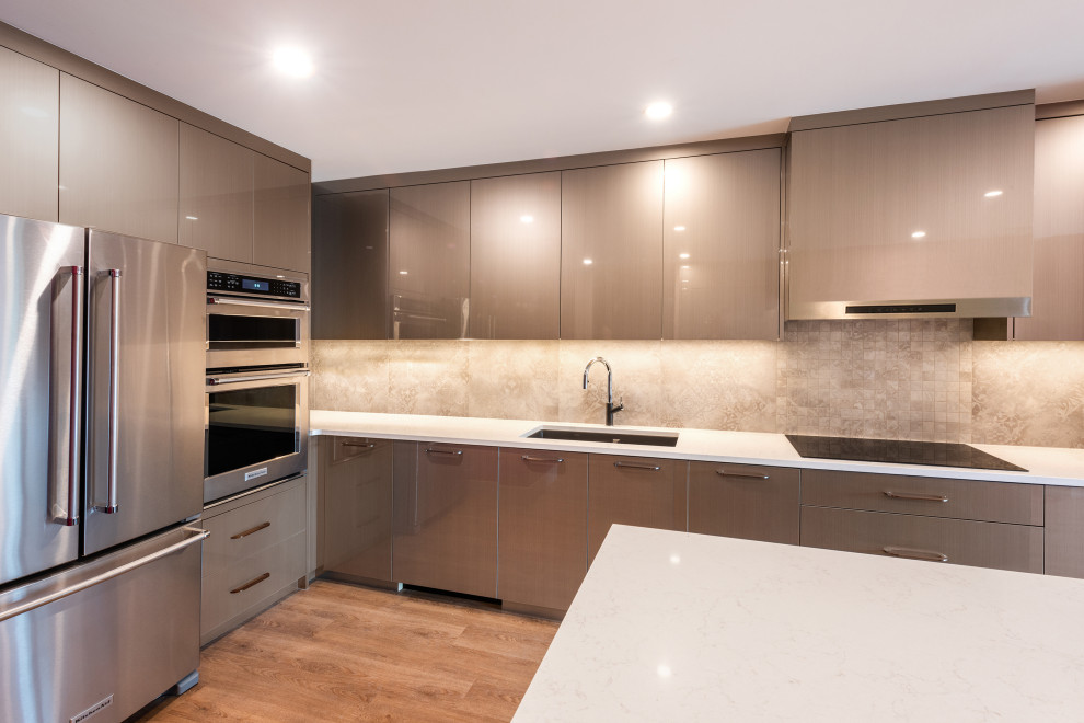 Inspiration for a mid-sized contemporary galley eat-in kitchen in Vancouver with an undermount sink, flat-panel cabinets, beige cabinets, quartz benchtops, multi-coloured splashback, porcelain splashback, stainless steel appliances, vinyl floors, with island, beige floor and white benchtop.