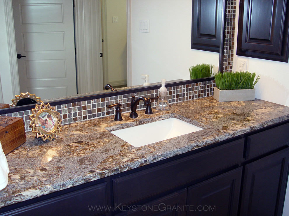 Bathroom - mid-sized transitional 3/4 bathroom idea in Austin with raised-panel cabinets, dark wood cabinets, white walls, an undermount sink and granite countertops