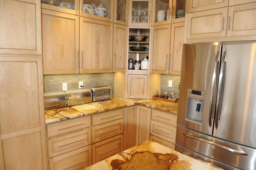 Inspiration for a mid-sized transitional u-shaped light wood floor eat-in kitchen remodel in Baltimore with a farmhouse sink, beaded inset cabinets, light wood cabinets, onyx countertops, stainless steel appliances and an island