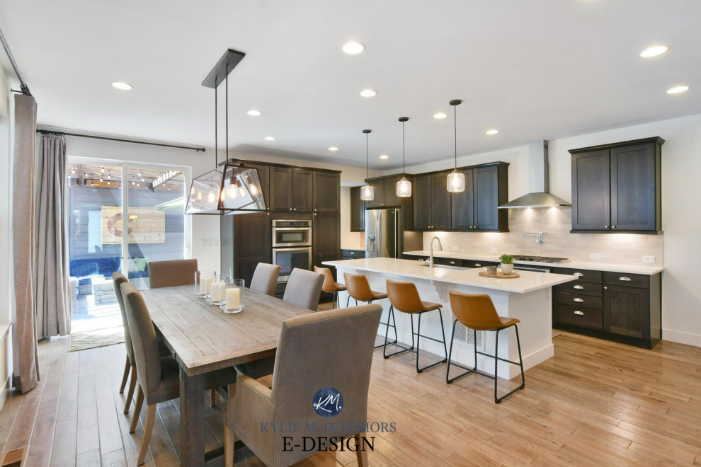 Inspiration for a mid-sized transitional l-shaped porcelain tile and brown floor open concept kitchen remodel with an undermount sink, shaker cabinets, dark wood cabinets, quartz countertops, beige backsplash, porcelain backsplash, stainless steel appliances, an island and white countertops