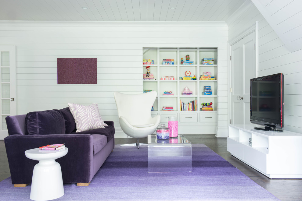 Photo of a large transitional kids' room for girls in New York with white walls and dark hardwood floors.