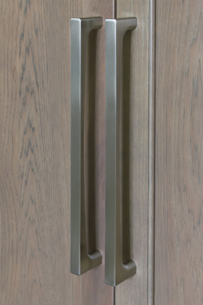 Eat-in kitchen - mid-sized transitional l-shaped ceramic tile and beige floor eat-in kitchen idea in Chicago with an undermount sink, flat-panel cabinets, beige cabinets, quartz countertops, beige backsplash, ceramic backsplash, stainless steel appliances, an island and white countertops