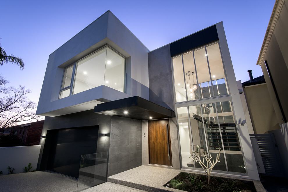 Photo of a mid-sized modern two-storey brick white exterior in Perth with a flat roof.