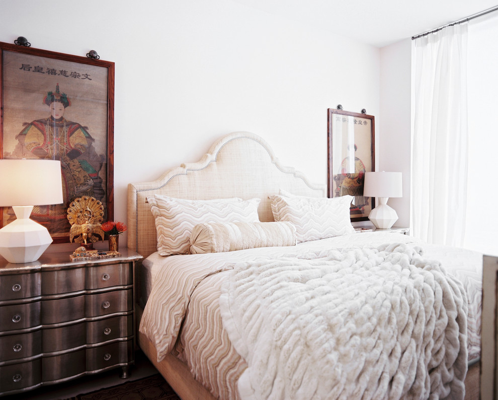 Design ideas for an eclectic bedroom in New York with white walls and no fireplace.