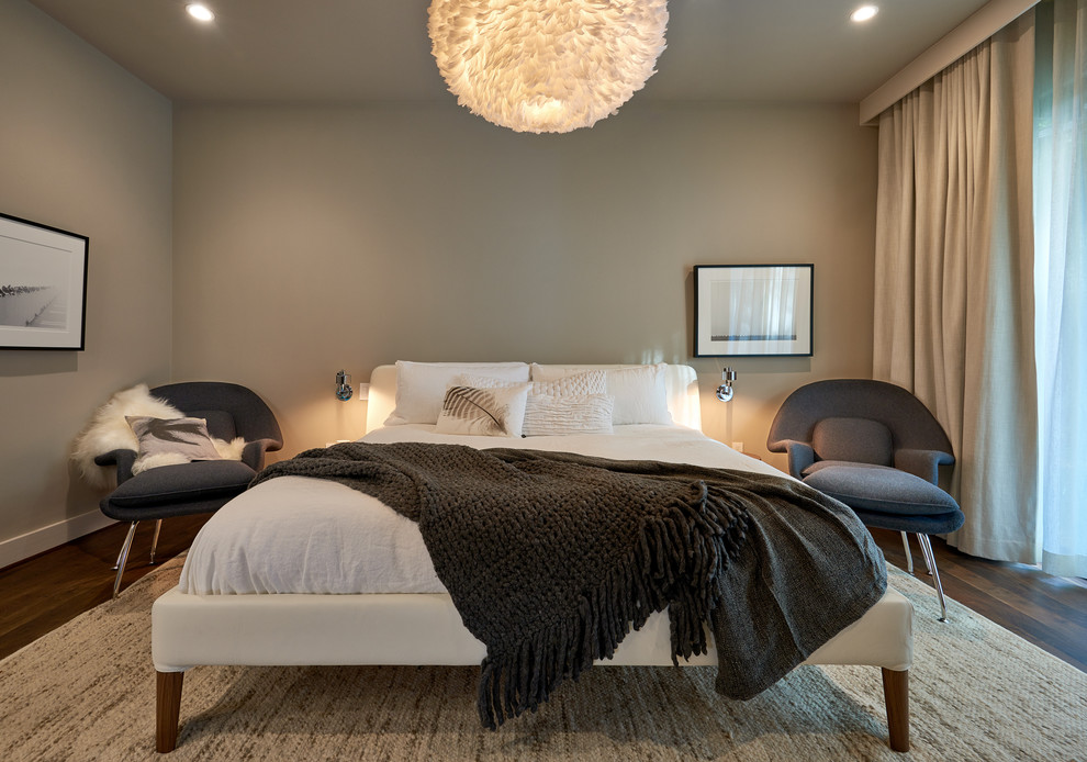 Design ideas for a large contemporary guest bedroom in Houston with grey walls and dark hardwood floors.