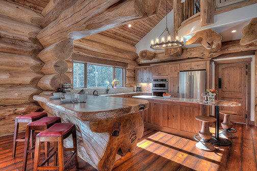 Inspiration for a mid-sized rustic u-shaped open concept kitchen remodel in Denver with shaker cabinets, medium tone wood cabinets and two islands