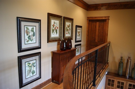 This is an example of a mid-sized transitional hallway in Atlanta with beige walls and medium hardwood floors.