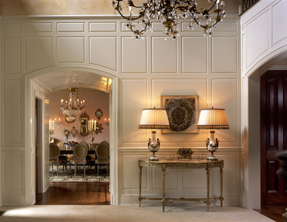 This is an example of a traditional foyer in New York with beige walls.