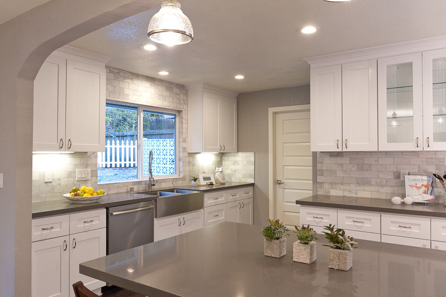 Large scandinavian open plan kitchen in Sacramento with quartz benchtops and with island.