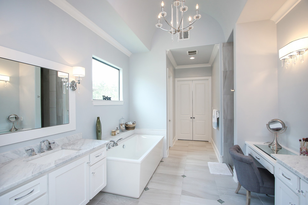 Design ideas for a transitional bathroom in Houston with shaker cabinets, white cabinets, ceramic tile, blue walls, ceramic floors, an undermount sink, granite benchtops, grey floor, a hinged shower door and white benchtops.