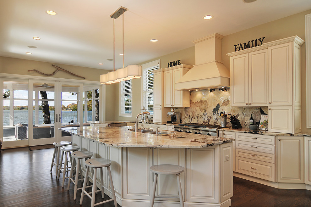 Inspiration for a large traditional galley eat-in kitchen in Chicago with raised-panel cabinets, beige cabinets, stainless steel appliances, granite benchtops, multi-coloured splashback, stone slab splashback, dark hardwood floors, with island, an undermount sink, brown floor and multi-coloured benchtop.