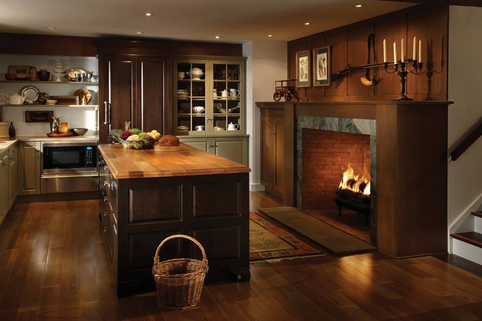 Design ideas for a large country u-shaped open plan kitchen in Houston with dark wood cabinets, medium hardwood floors, with island, white splashback and stainless steel appliances.