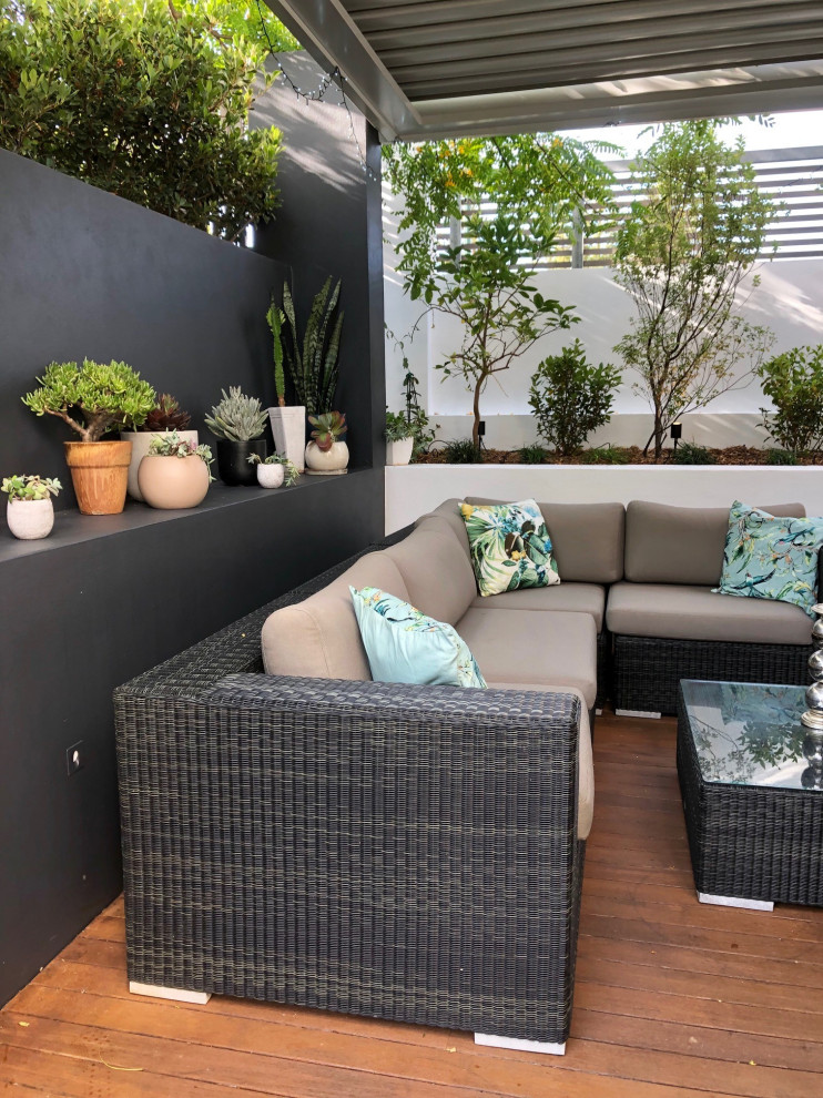 Small mediterranean courtyard patio in Perth with a pergola.