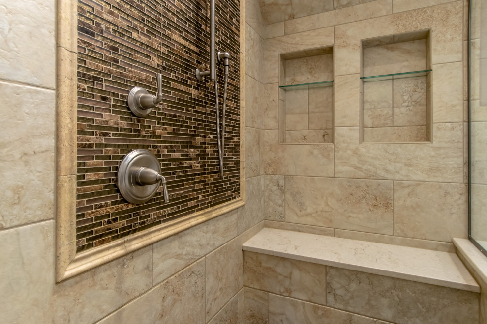 Photo of an expansive modern master wet room bathroom in Chicago with dark wood cabinets, a corner tub, beige tile, stone tile, marble benchtops, a hinged shower door, a shower seat, a double vanity, a built-in vanity and vaulted.