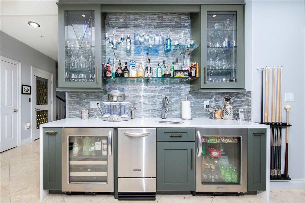 Mid-sized contemporary l-shaped home bar in Other with an undermount sink, shaker cabinets, grey cabinets, quartz benchtops, mosaic tile splashback, ceramic floors, beige floor and white benchtop.