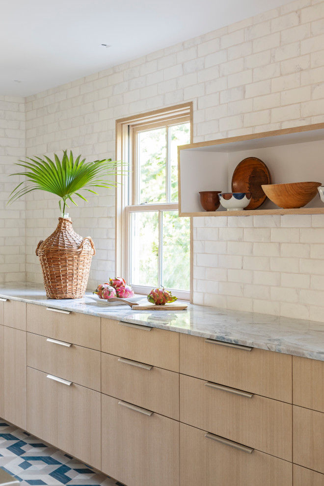 Inspiration for a mid-sized beach style galley open plan kitchen in Charleston with an undermount sink, flat-panel cabinets, light wood cabinets, quartzite benchtops, terra-cotta splashback, panelled appliances, painted wood floors, a peninsula, blue floor and blue benchtop.
