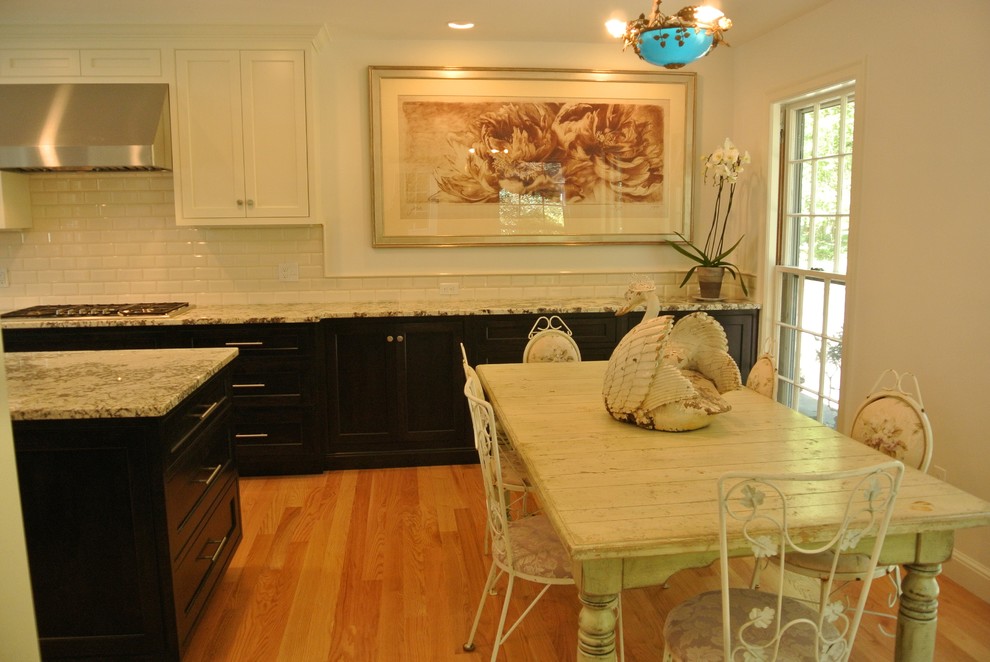 Transitional light wood floor eat-in kitchen photo in Boston with an undermount sink, shaker cabinets, granite countertops, white backsplash, subway tile backsplash, stainless steel appliances and an island
