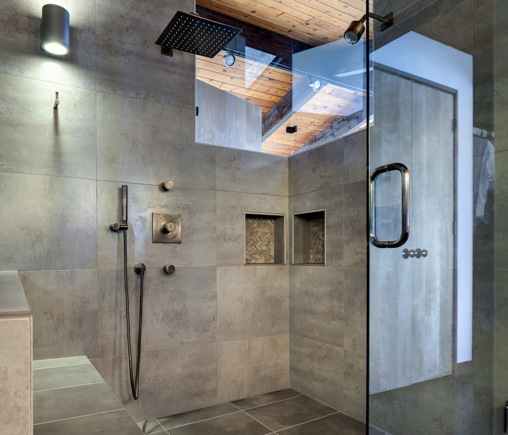 Photo of a contemporary master bathroom in Other with an undermount sink, flat-panel cabinets, dark wood cabinets, engineered quartz benchtops, a one-piece toilet and gray tile.