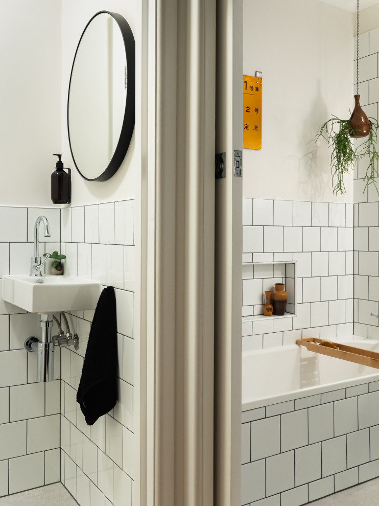Midcentury bathroom in Melbourne with flat-panel cabinets, white cabinets, an alcove tub, an open shower, white tile, subway tile, white walls, porcelain floors, an integrated sink, solid surface benchtops, white floor, white benchtops, a single vanity and a floating vanity.