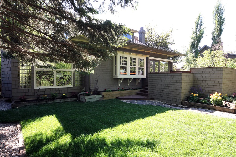 Example of a transitional exterior home design in Calgary