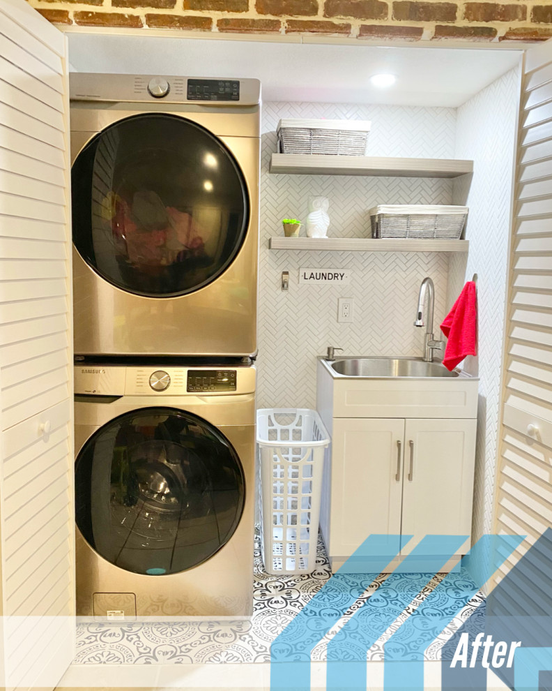 Mid-sized country single-wall laundry cupboard in Miami with an integrated sink, shaker cabinets, white cabinets, stainless steel benchtops, white splashback, mosaic tile splashback, white walls, porcelain floors, a stacked washer and dryer, white floor, grey benchtop and brick walls.