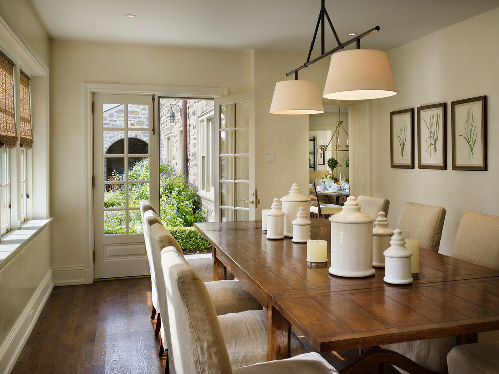 Traditional dining room in Philadelphia with beige walls and dark hardwood floors.