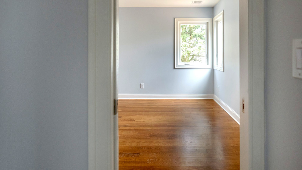 Corner-Window Bedroom with Wood Floors