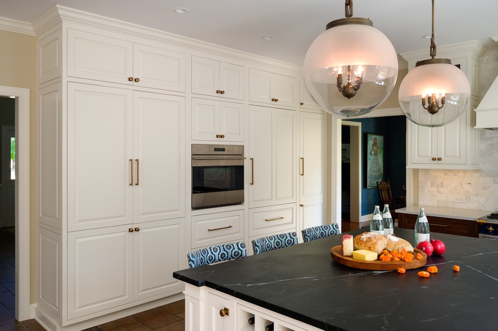 Eat-in kitchen - large transitional l-shaped ceramic tile eat-in kitchen idea with an undermount sink, beaded inset cabinets, medium tone wood cabinets, soapstone countertops, white backsplash, subway tile backsplash, colored appliances and an island