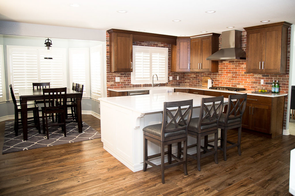 This is an example of a large arts and crafts kitchen/dining combo in Denver with dark hardwood floors.