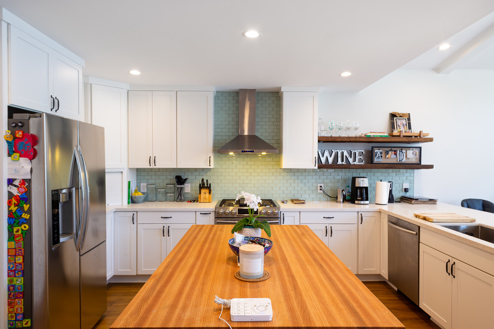 Photo of a mid-sized beach style kitchen in San Luis Obispo with laminate floors.