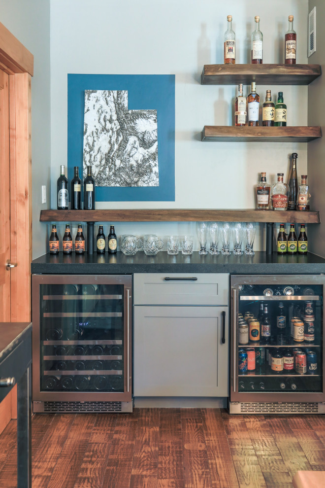 Small rustic single-wall dry bar in Salt Lake City with shaker cabinets, grey cabinets, granite worktops, medium hardwood flooring, brown floors and black worktops.