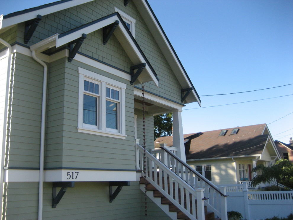 Photo of an arts and crafts one-storey exterior in Seattle with wood siding.