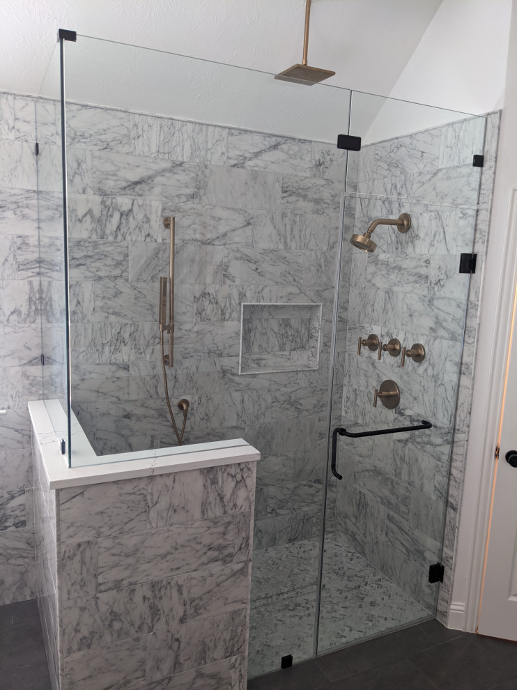 This is an example of a large modern master bathroom in Houston with flat-panel cabinets, medium wood cabinets, a freestanding tub, a curbless shower, a bidet, white tile, marble, grey walls, porcelain floors, an undermount sink, engineered quartz benchtops, grey floor, a hinged shower door, yellow benchtops, a shower seat, a double vanity and a built-in vanity.