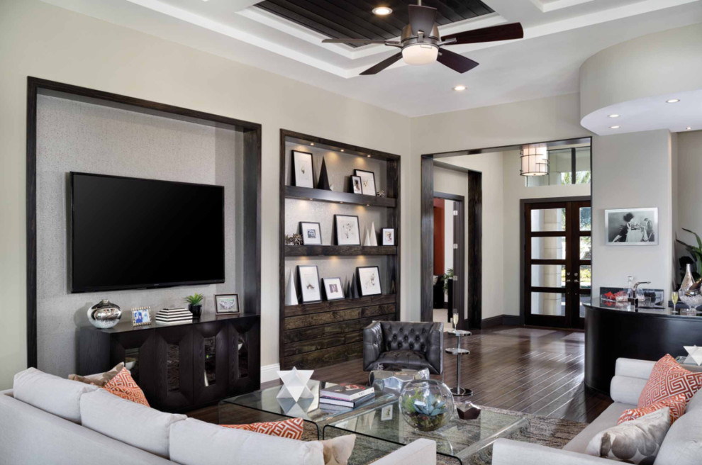Inspiration for a large contemporary open concept living room in San Diego with a home bar, white walls, dark hardwood floors, no fireplace, a wall-mounted tv and brown floor.