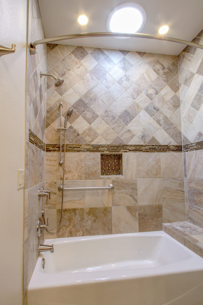 Inspiration for a transitional beige tile and ceramic tile drop-in bathtub remodel