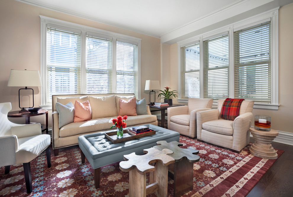 Inspiration for a transitional living room in Chicago with beige walls and dark hardwood floors.