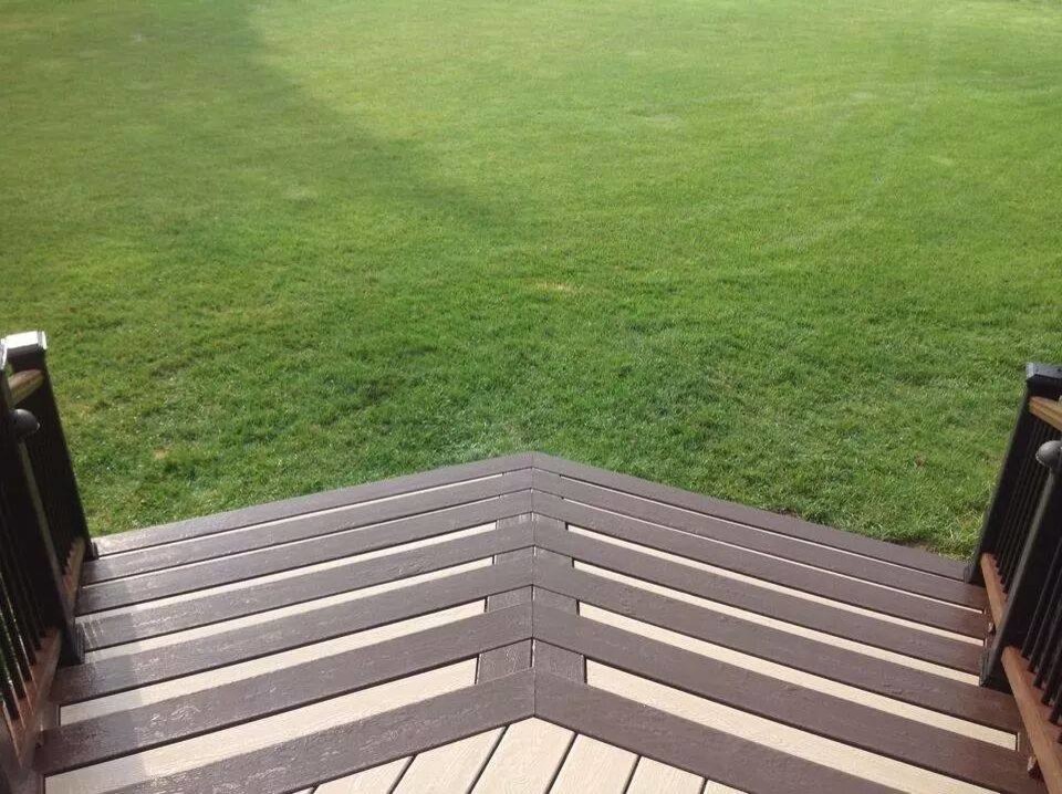 Example of a huge minimalist backyard deck design with no cover