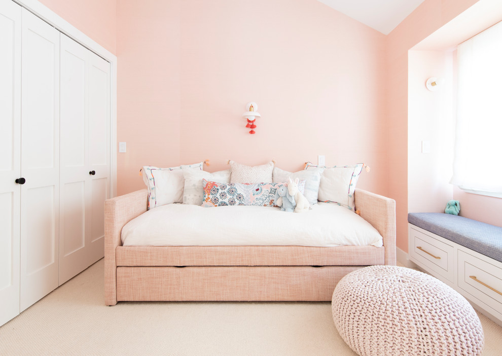 Country kids' bedroom in San Francisco with pink walls, carpet and beige floor for girls.